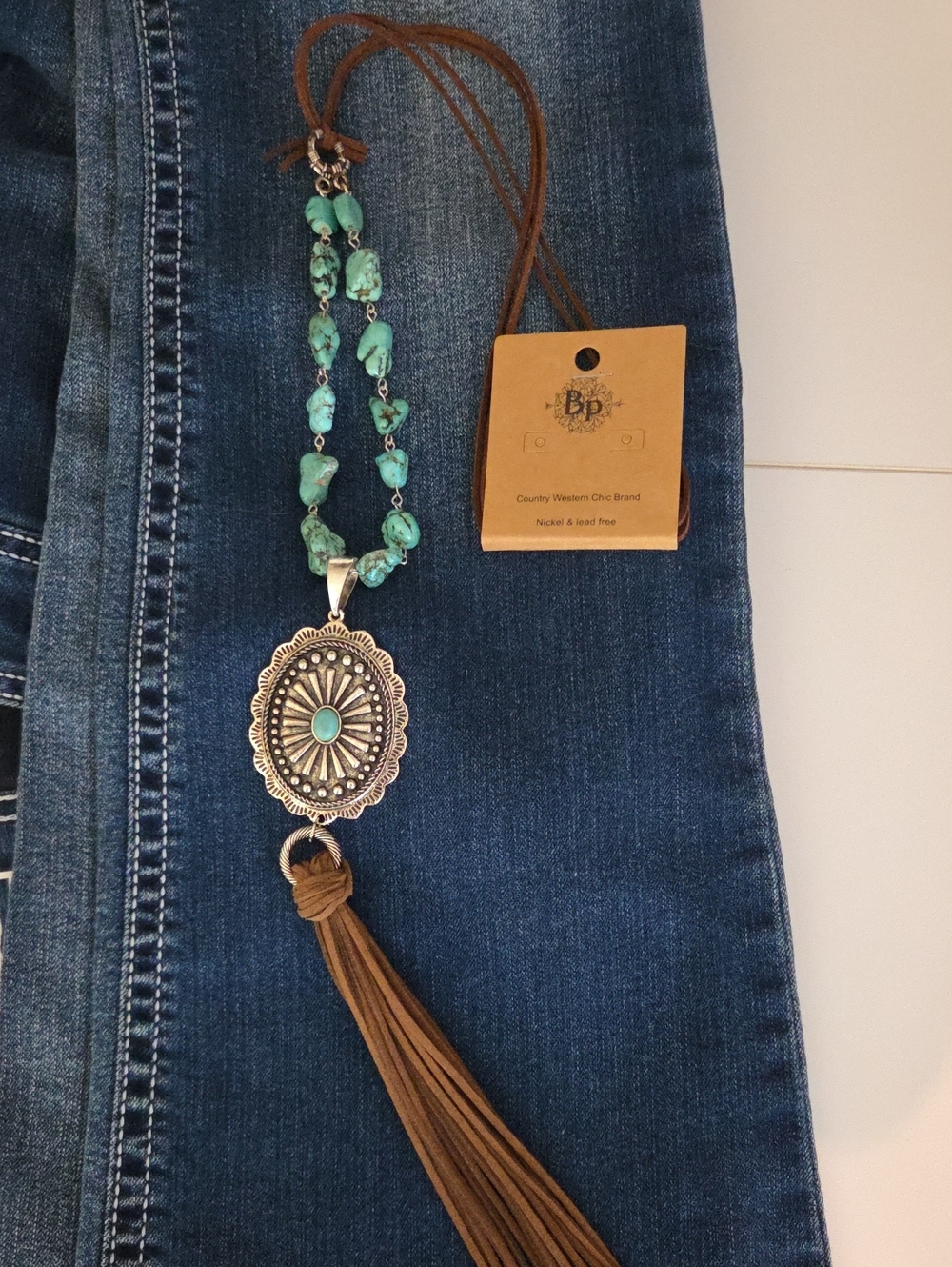 bp Turquoise Bead Necklace with Brown Suede Tassel